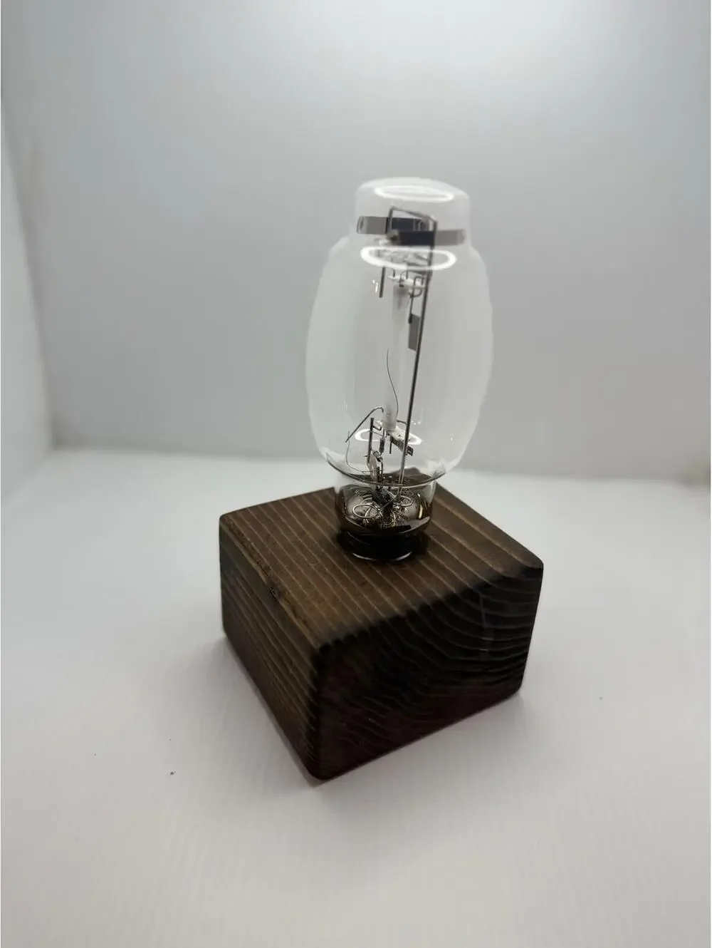 Vintage Retro High Pressure Sodium Industrial Bulb Display on Wood Pedestal